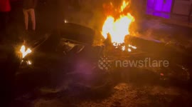 Palestinian demonstrators burn tires and block the road leading to Joseph's Tomb