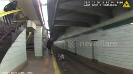 Heroic moment two NYPD officers save man after he fell onto subway tracks