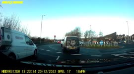 white van undertakes on a roundabout car cuts van up near crash