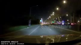 Ghost motorcycle rolls in front of car on Thai highway