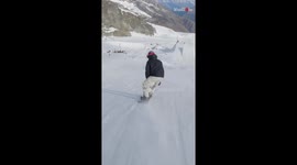 Snowboarder fades into snow after going 'FULL SEND' with his front side 1800 attempt
