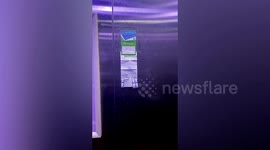 Neighbour hands out medicine for free in lift during COVID-19 surge in China