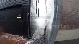 Waves Crashing Between Two Houses in Coastal Massachusetts During Winter Storm Elliott