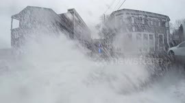 US winter storm: Large waves crash against homes and restaurant in Massachusetts
