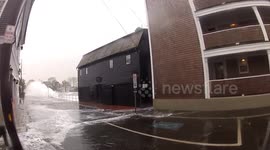 Huge Waves Crashing Around A House in Coastal Massachusetts During Winter Storm Elliott