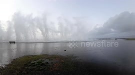Huge waves surging along the Belt Parkway in Brooklyn