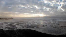 Winter Storm Creates Powerful Surf and Beach Foam at Rockaway Beach