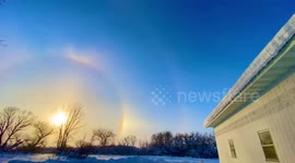Subzero temperatures produce rare double Sundog