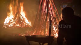 Greeks light huge bonfires in towns and villages in revival of traditional Christmas custom