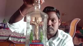 Miniature artist from eastern India creates statuette of Jesus Christ inside glass bottle ahead of Christmas day