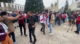 Tourists and pilgrims celebrate Christmas eve at the Church of the Nativity