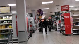 Last minute Christmas Eve shoppers strip the shelves of Christmas food 8n Supermarkets