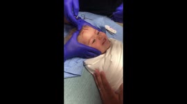 two years old, getting stitches in her for head and laughing the whole time!