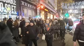 Last-minute Christmas rush: Shoppers throng London's Oxford Street on Christmas Eve