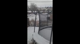 This guy is showing his Christmas spirit in a snowy road, just don't get run over buddy