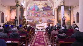 Christians join mass in church on Christmas Eve in Gaza
