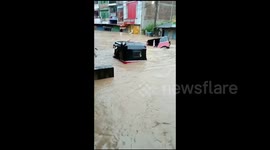 goods are floating on the water in the supermarket,highlands cities are flooded and water is going over 5 feet on the road