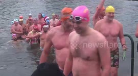 Serpentine Swimming Club's Peter Pan Cup race takes place in London's Hyde Park on Christmas Day