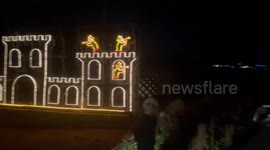 Police were called after a tank full of Santas caused chaos by getting stuck down a village lane during a pub crawl