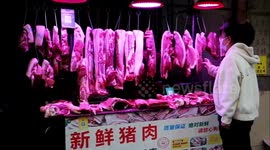 People Buy Pork At A Market in Yichang, China