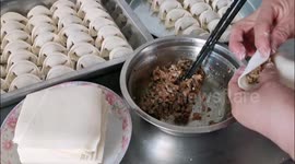 Families Make And Eat Dumplings In Yichang, China