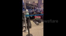 US: Baggage Piled Up At Airports Across Country As Flights Cancelled Due To Severe Weather 2