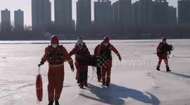 Chinese firefighters rescue 70-year-old drowning man from frozen river after he falls into hole