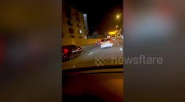 Delighted driver spots sedan decorated with festive lights along road on Christmas Day in Thailand