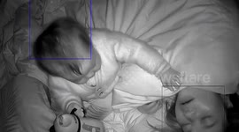 One-year-old baby feeds water to mother ill with COVID-19