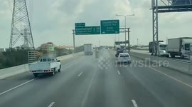 Loose wheel pinballs across busy highway causing chaos for cars