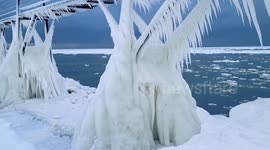Extreme cold weather freezes pier, lighthouse in Michigan