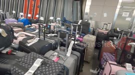 Storm Elliott: Endless rows of unclaimed baggage at Denver International Airport