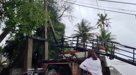 Hanging bridge collapses as Christmas storms batter homes killing at least 13 in the Philippines