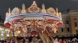 French carousel is set at the ice-rink on Manezh square. St Petersburg, Russia