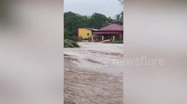 House collapses in raging flood as death toll from Philippines storm climbs to 25