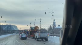 Line of snow removal vehicles as deadly winter storm hits Buffalo, New York