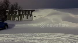 Street in Watertown, NY, USA covered with large amount of snow
