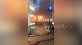 Flames rage inside Cambodia casino where fire 'kills 10' and traps dozens more