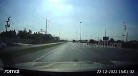 Bungling truck driver causes domino-effect car crash when he suddenly makes u-turn