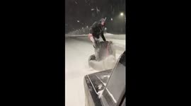 Man rides armchair attached to car driving along icy road in Russia