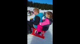 Children sledding collide with unsuspecting woman