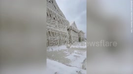 Homes encased in thick layer of ice after storm Elliott wreaks havoc across North America