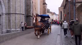 Tourists enjoy popular European Christmas market in Bruges, Belgium