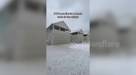 NEW VIDEO: Homes encased in thick layer of ice after storm Elliott wreaks havoc across North America