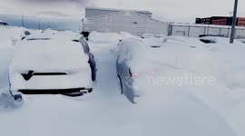 Man needs four hours to dig out his car completely encased in hard snow in Icelandic parking lot