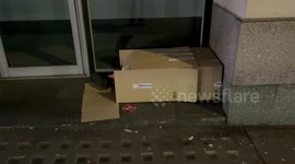Homeless person sleeps inside cardboard box in London as US winter moves into UK