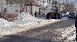 Аront loader cleaning streets from snow in Buffalo, NY, USA