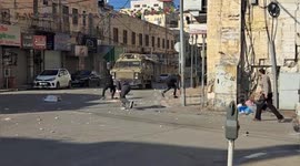 Palestinian protesters rally amid clashes with Israeli forces deploying during a raid in the old city of Nablus, in the West Bank