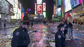 Times Square New Year’s aftermath: confetti strewn as NYPD removes barriers