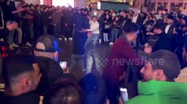 People celebrate New Year 2023 at Piccadilly Circus in central London
